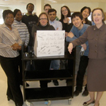 Photo of staff processing one millionth book.