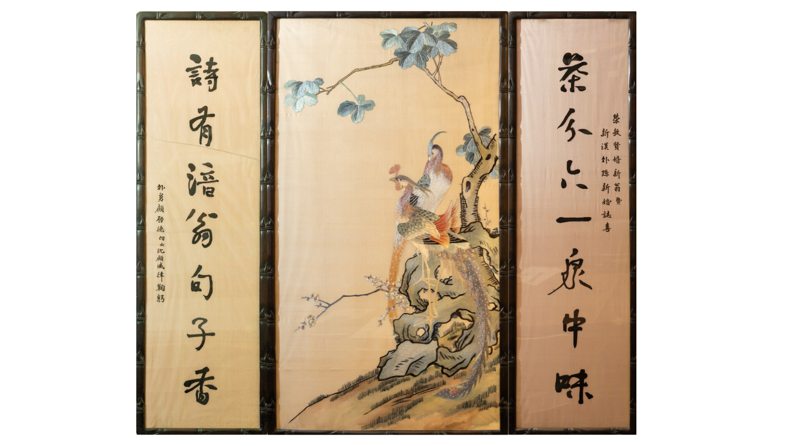 Three Chinese panels featuring an embroided painting of two birds in the middle.