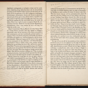 A yellowing book is spread open with written annotations in the margins in pencil.